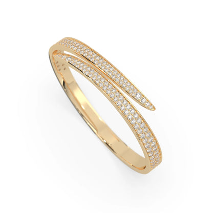 Round pavé set lab grown diamond bypass open cuff bangle bracelet with elegant sculptural crossover silhouette in yellow gold metal tone