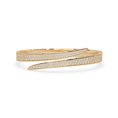 Round pavé set lab grown diamond bypass open cuff bangle bracelet with elegant sculptural crossover silhouette in yellow gold metal tone
