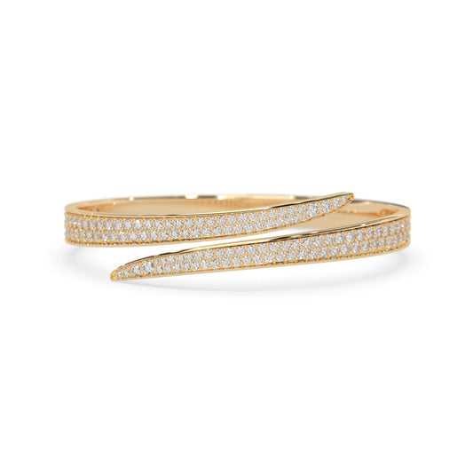 Round pavé set lab grown diamond bypass open cuff bangle bracelet with elegant sculptural crossover silhouette in yellow gold metal tone