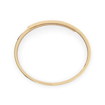 Round pavé set lab grown diamond bypass open cuff bangle bracelet with elegant sculptural crossover silhouette in yellow gold metal tone