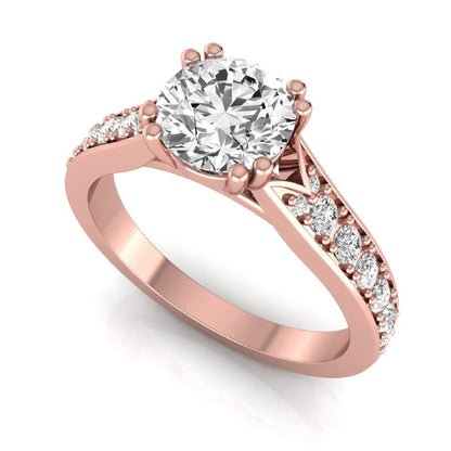 Round cut lab grown diamond engagement ring featuring an IGI certified center diamond with pavé set round diamonds on a tapered band in a classic six-prong setting in rose gold