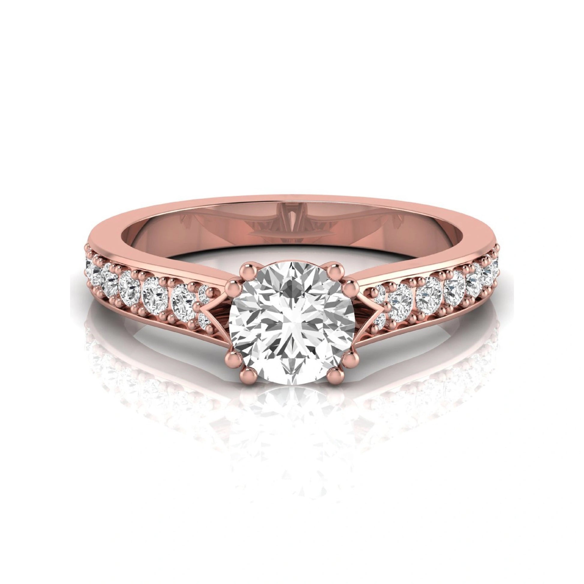 Round cut lab grown diamond engagement ring featuring an IGI certified center diamond with pavé set round diamonds on a tapered band in a classic six-prong setting in rose gold