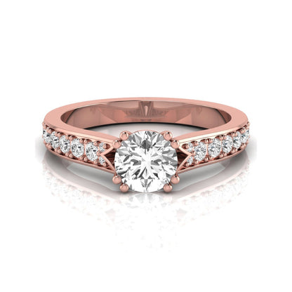 Round cut lab grown diamond engagement ring featuring an IGI certified center diamond with pavé set round diamonds on a tapered band in a classic six-prong setting in rose gold