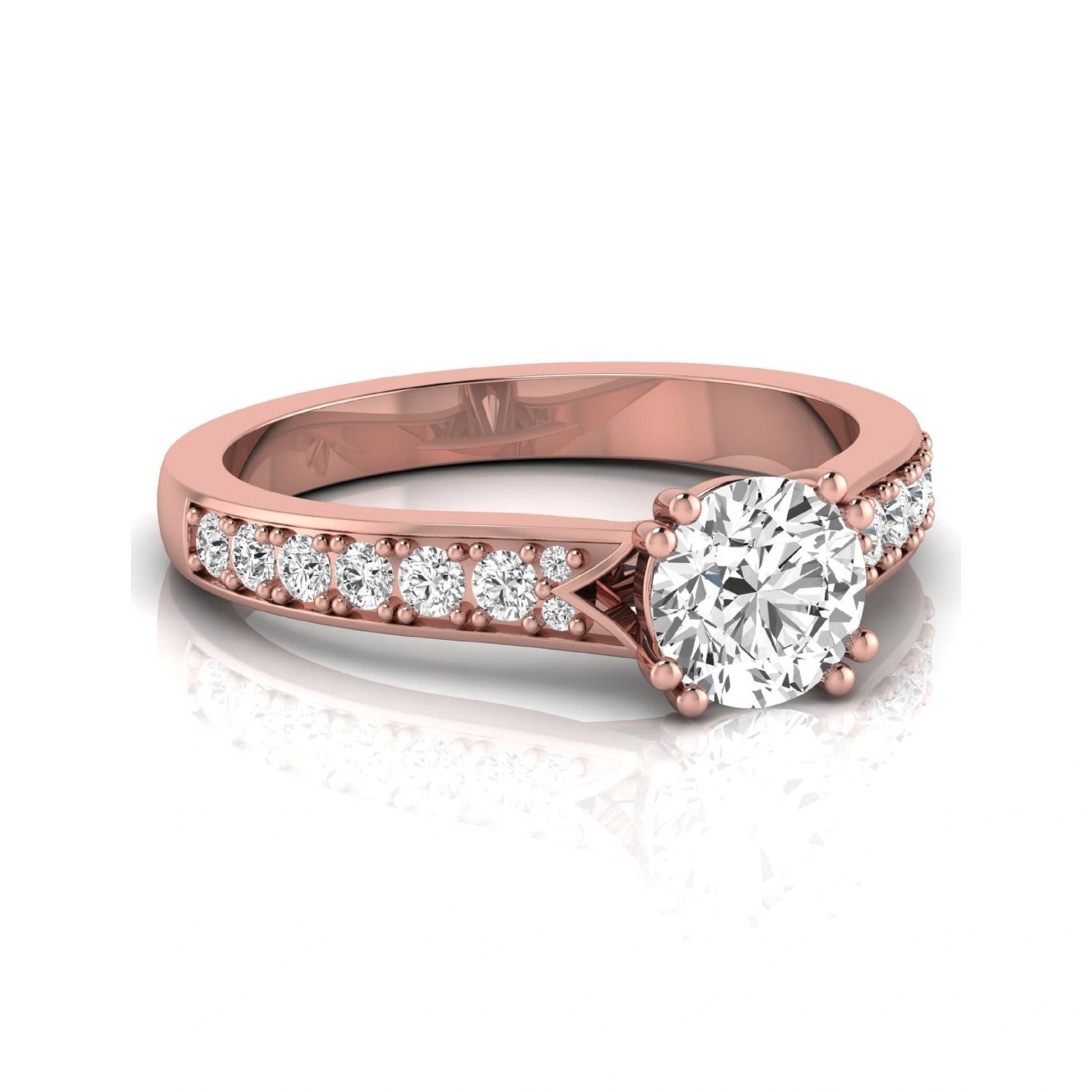Round cut lab grown diamond engagement ring featuring an IGI certified center diamond with pavé set round diamonds on a tapered band in a classic six-prong setting in rose gold