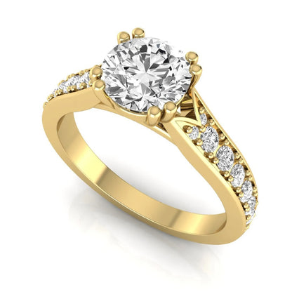 Round cut lab grown diamond engagement ring featuring an IGI certified center diamond with pavé set round diamonds on a tapered band in a classic six-prong setting in yellow gold