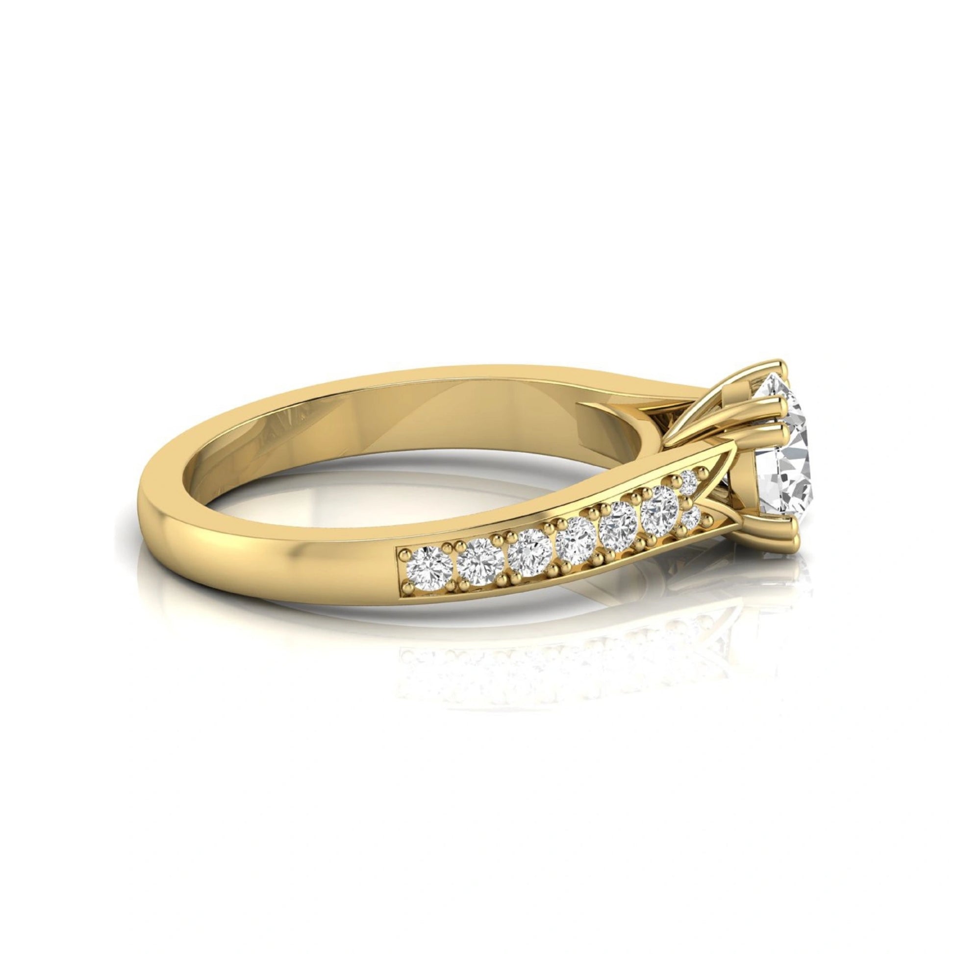 Round cut lab grown diamond engagement ring featuring an IGI certified center diamond with pavé set round diamonds on a tapered band in a classic six-prong setting in yellow gold