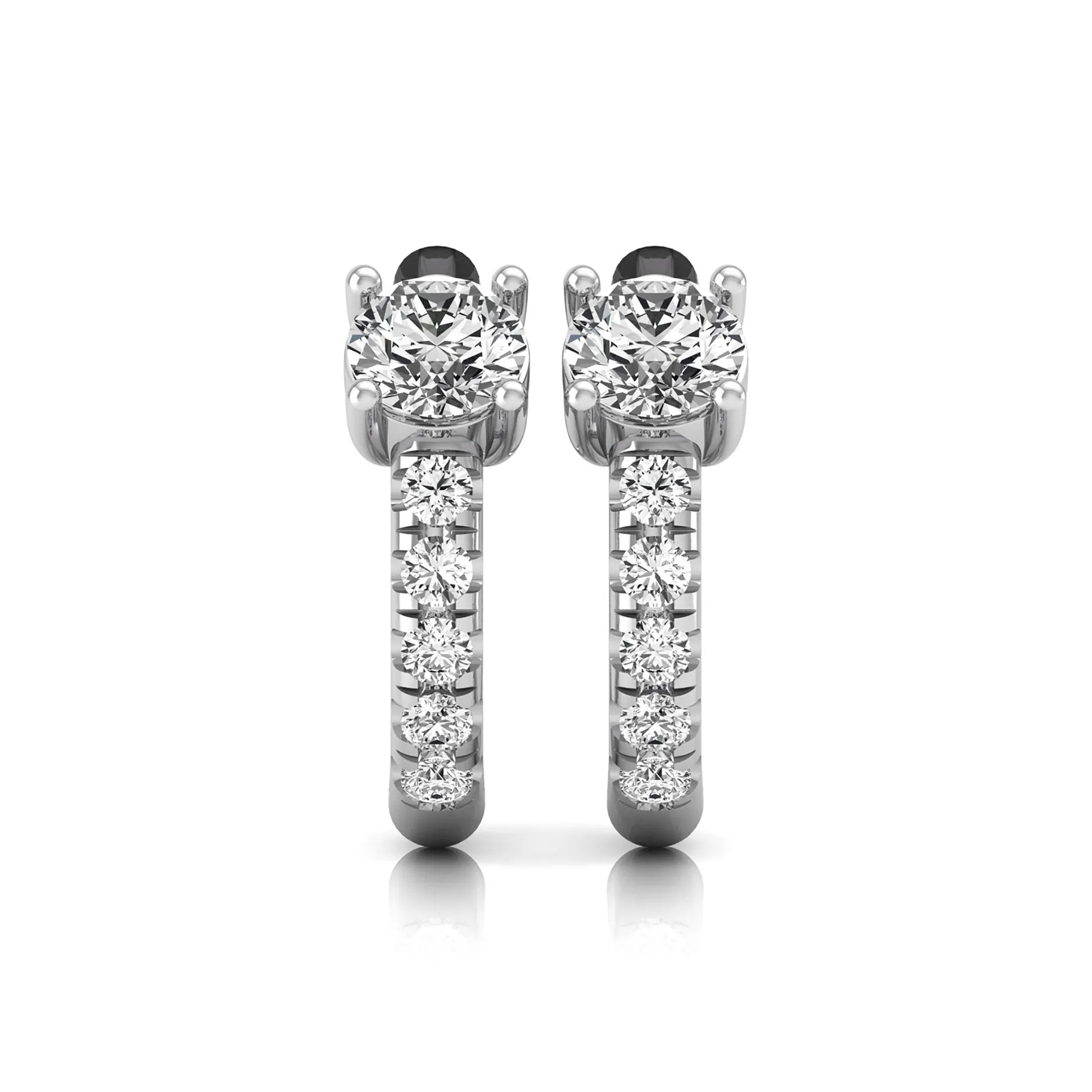 Round brilliant lab grown diamond huggie hoop earrings featuring an elevated four prong center diamond with graduated shared prong pavé round diamond accents in white gold.