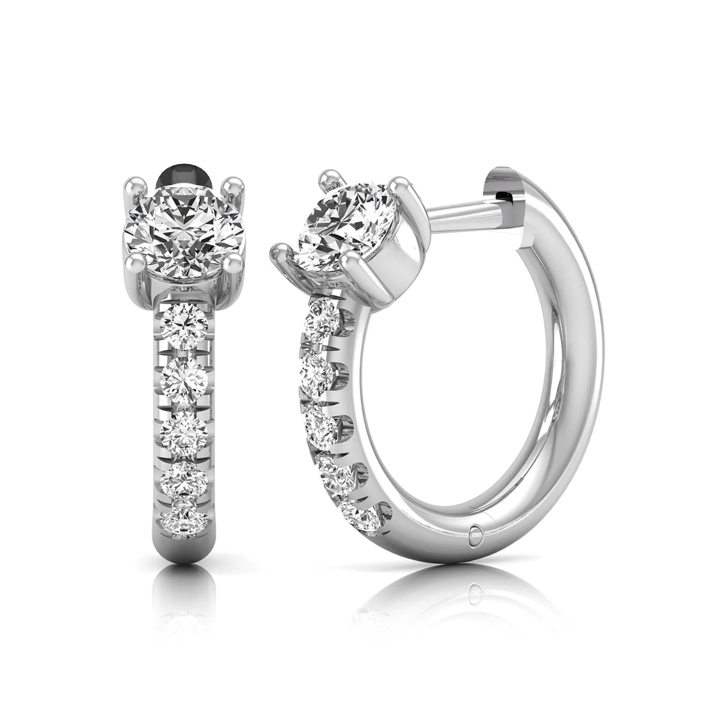 Round brilliant lab grown diamond huggie hoop earrings featuring an elevated four prong center diamond with graduated shared prong pavé round diamond accents in white gold.