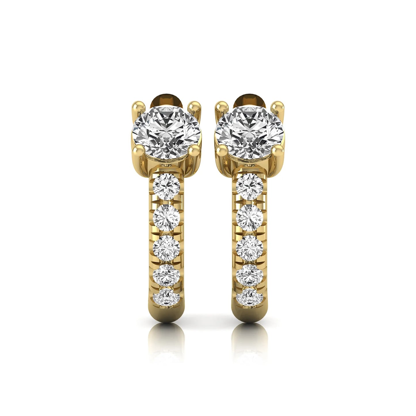 Round brilliant lab grown diamond huggie hoop earrings featuring an elevated four prong center diamond with graduated shared prong pavé round diamond accents in yellow gold.