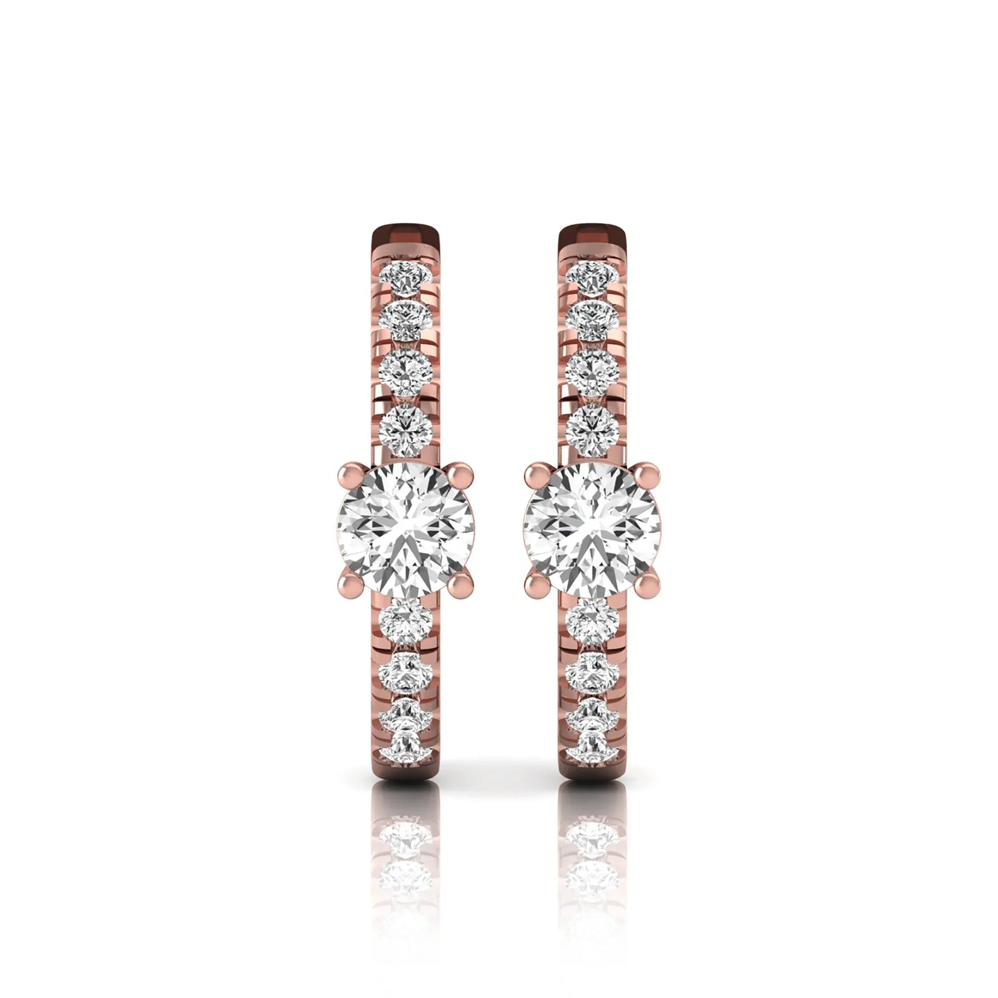 Round brilliant lab grown diamond pavé huggie hoop earrings featuring a four prong center diamond with graduated shared prong pavé round diamonds in rose gold.