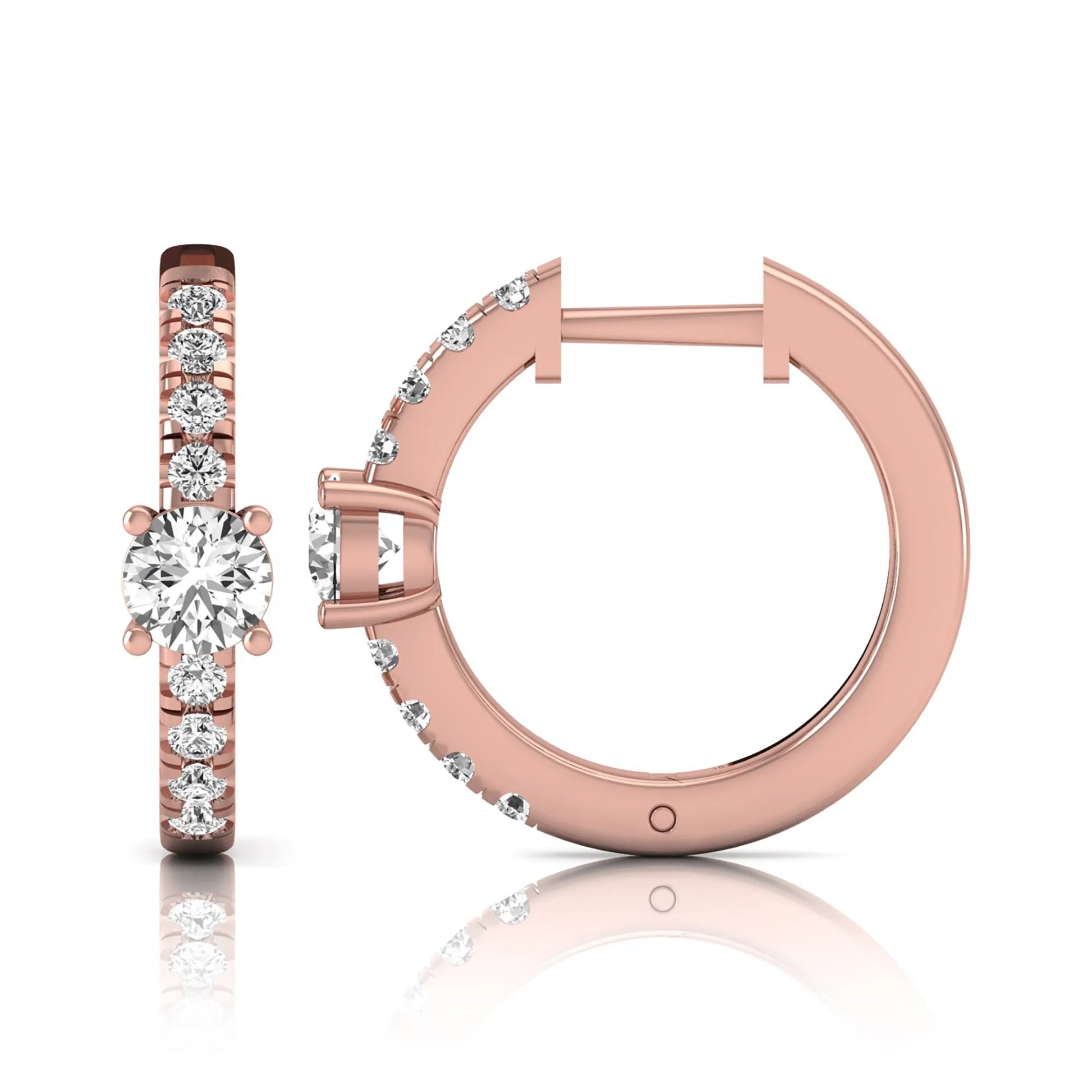 Round brilliant lab grown diamond pavé huggie hoop earrings featuring a four prong center diamond with graduated shared prong pavé round diamonds in rose gold.