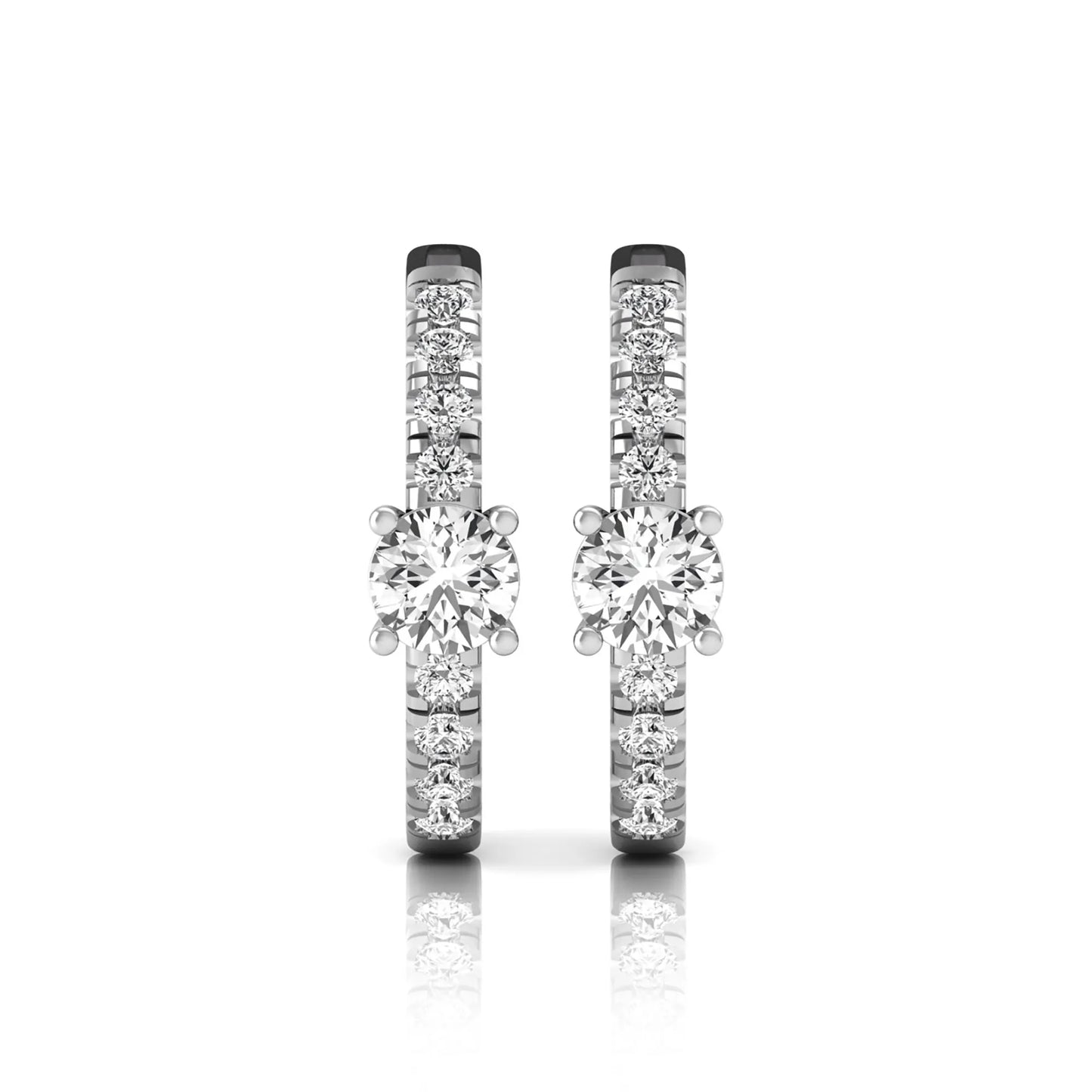 Round brilliant lab grown diamond pavé huggie hoop earrings featuring a four prong center diamond with graduated shared prong pavé round diamonds in white gold.