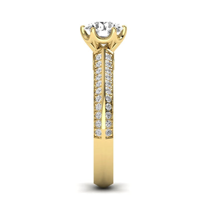 Round cut lab grown diamond engagement ring featuring a six-prong setting with pavé accent diamonds and yellow gold finish.