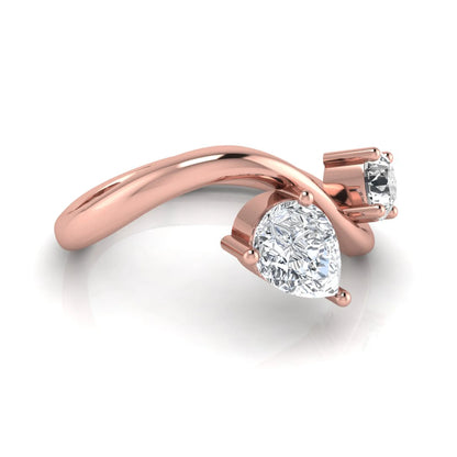 Round and pear cut lab grown diamond Toi et Moi ring with an elegant flowing crossover design in rose gold