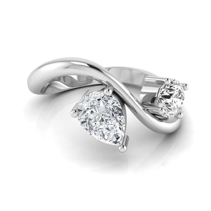Round and pear cut lab grown diamond Toi et Moi ring with an elegant flowing crossover design in white gold
