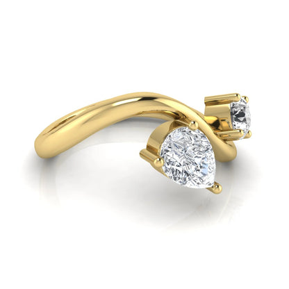 Round and pear cut lab grown diamond Toi et Moi ring with an elegant flowing crossover design in yellow gold