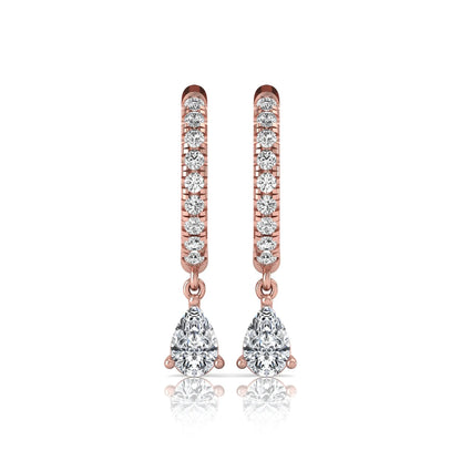 Round and pear cut lab grown diamond pavé drop huggie hoop earrings featuring a sparkling pear diamond drop, round pavé diamonds, hinged snap closure, and polished rose gold finish.