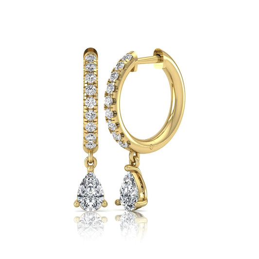 Round and pear cut lab grown diamond pavé drop huggie hoop earrings featuring a sparkling pear diamond drop, round pavé diamonds, hinged snap closure, and polished yellow gold finish.