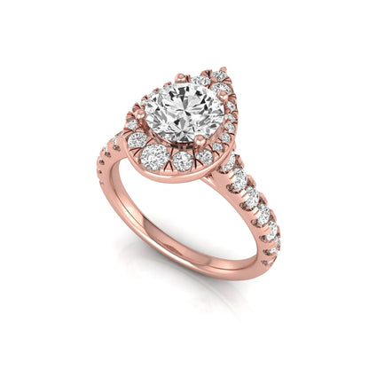 Round cut lab grown diamond engagement ring with a pear-shaped halo of round diamonds, pavé side stones, and a rose gold style band.