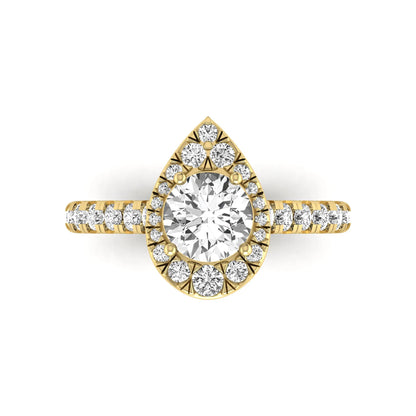 Round cut lab grown diamond engagement ring with a pear-shaped halo of round diamonds, pavé side stones, and a yellow gold style band.