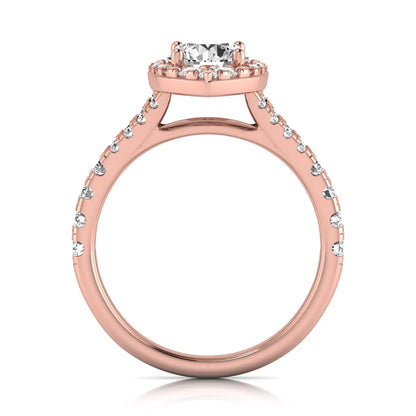 Round cut lab grown diamond engagement ring with a pear-shaped halo, split shank pavé band, and rose gold style.