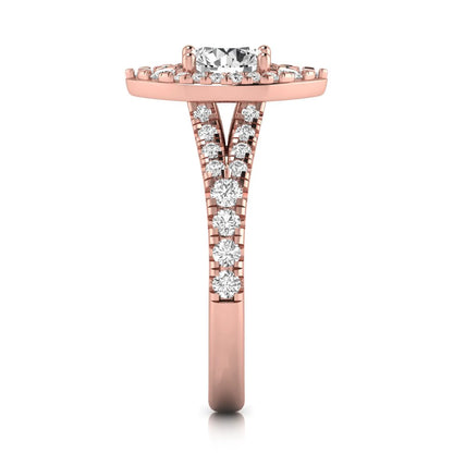 Round cut lab grown diamond engagement ring with a pear-shaped halo, split shank pavé band, and rose gold style.