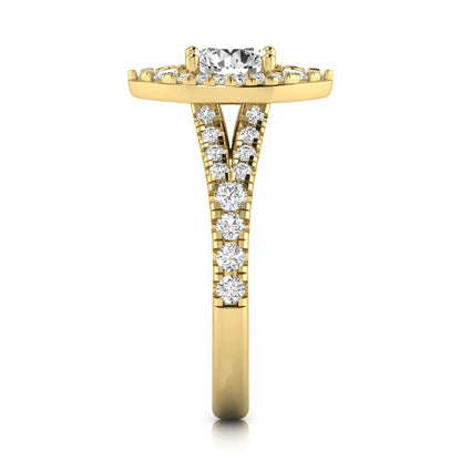 Round cut lab grown diamond engagement ring with a pear-shaped halo, split shank pavé band, and yellow gold style.