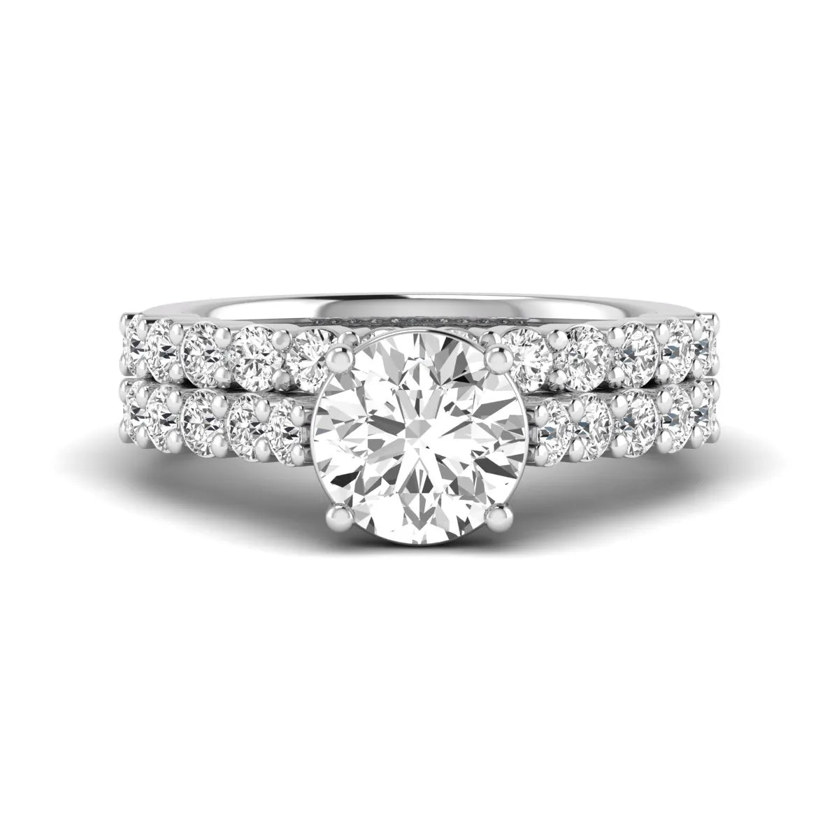 Round prong set lab grown diamond bridal ring set featuring a 2.00 carat round center diamond with matching round diamond bands in white gold finish.