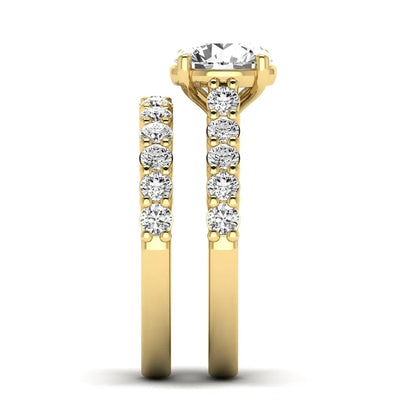 Round prong set lab grown diamond bridal ring set featuring a 2.00 carat round center diamond with matching round diamond bands in yellow gold finish.