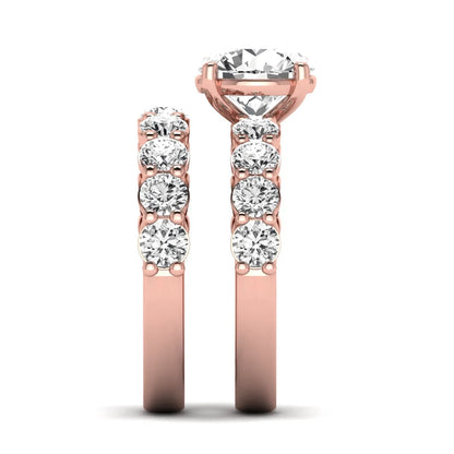 Round prong set lab grown diamond bridal ring set featuring a 2.50 carat round center diamond with double-row round accent diamonds in rose gold finish.