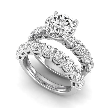 Round prong set lab grown diamond bridal ring set featuring a 2.50 carat round center diamond with double-row round accent diamonds in white gold finish.