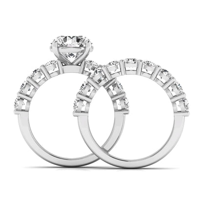 Round prong set lab grown diamond bridal ring set featuring a 2.50 carat round center diamond with double-row round accent diamonds in white gold finish.