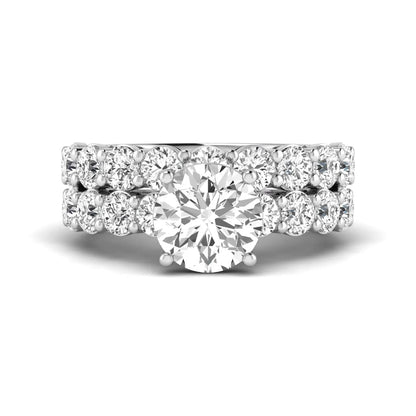 Round prong set lab grown diamond bridal ring set featuring a 2.50 carat round center diamond with double-row round accent diamonds in white gold finish.