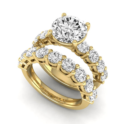 Round prong set lab grown diamond bridal ring set featuring a 2.50 carat round center diamond with double-row round accent diamonds in yellow gold finish.