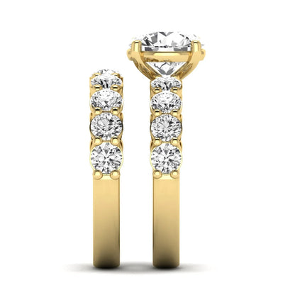 Round prong set lab grown diamond bridal ring set featuring a 2.50 carat round center diamond with double-row round accent diamonds in yellow gold finish.