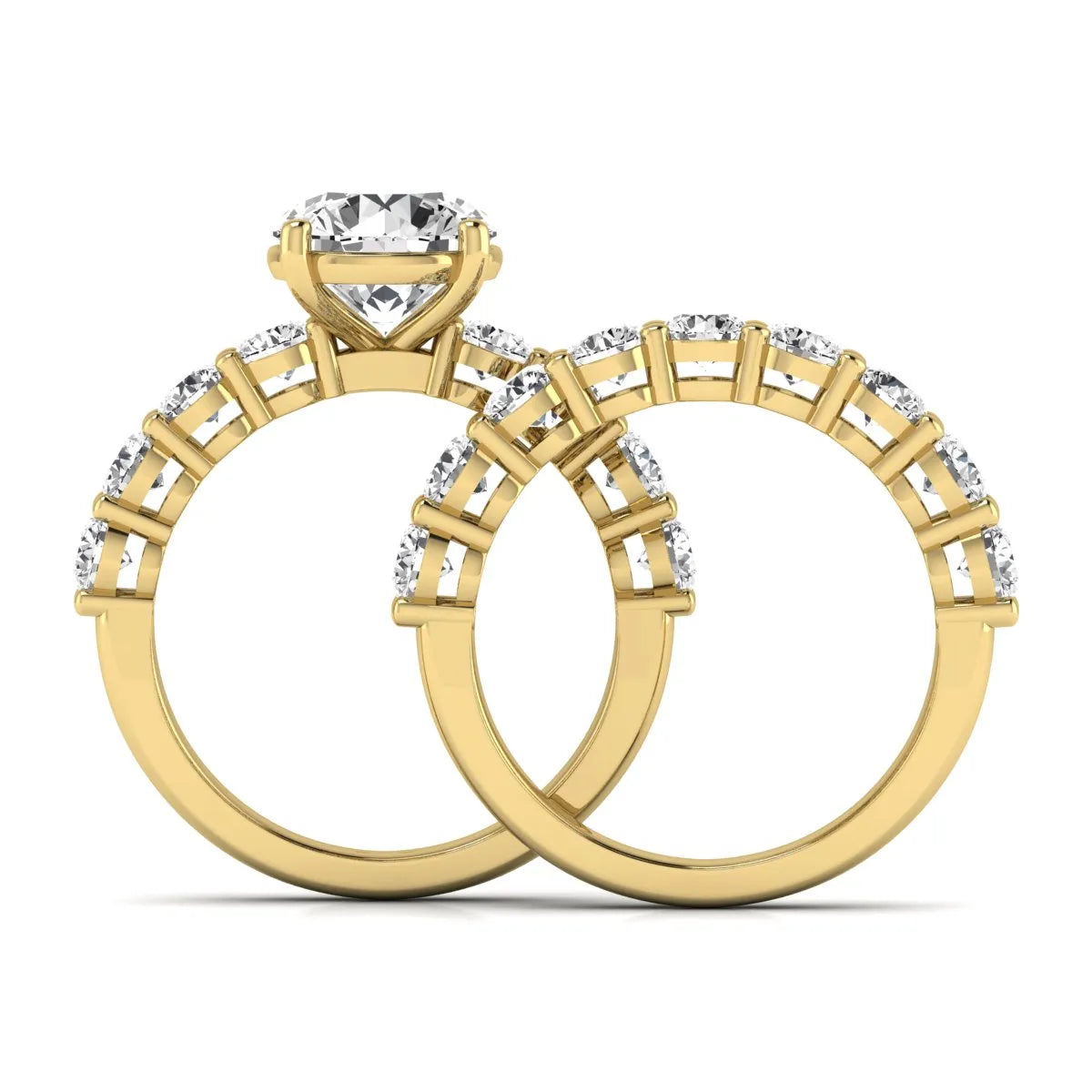 Round prong set lab grown diamond bridal ring set featuring a 2.50 carat round center diamond with double-row round accent diamonds in yellow gold finish.
