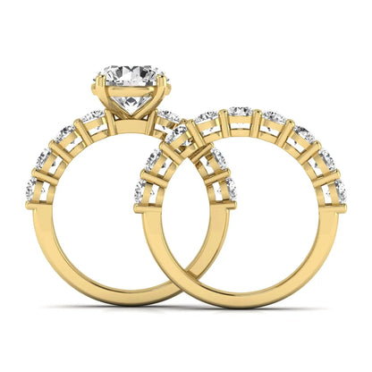 Round prong set lab grown diamond bridal ring set featuring a 2.50 carat round center diamond with double-row round accent diamonds in yellow gold finish.