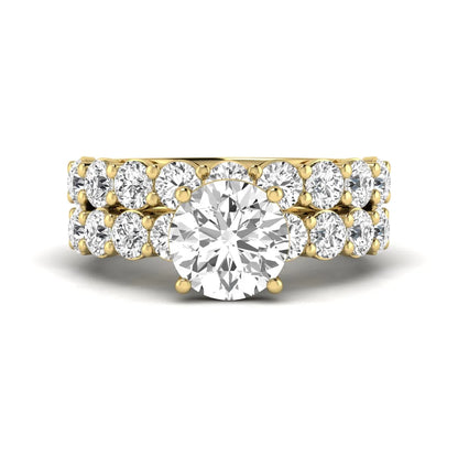Round prong set lab grown diamond bridal ring set featuring a 2.50 carat round center diamond with double-row round accent diamonds in yellow gold finish.