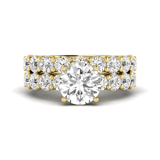 Round prong set lab grown diamond bridal ring set featuring a 2.50 carat round center diamond with double-row round accent diamonds in yellow gold finish.