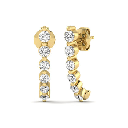 Round cut prong set lab grown diamond climber earrings featuring a curved graduated diamond design with push back closure in yellow gold tone.