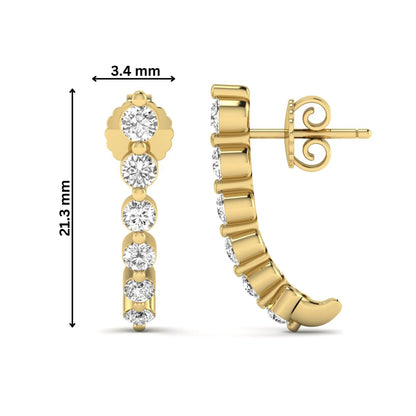 Round cut prong set lab grown diamond climber earrings featuring a curved graduated diamond design with push back closure in yellow gold tone.