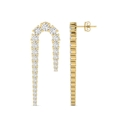 Round prong set lab grown diamond curved crawler earrings featuring graduating round diamonds in a yellow gold tone with push back closure.