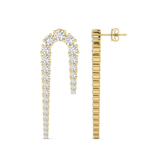 Round prong set lab grown diamond curved crawler earrings featuring graduating round diamonds in a yellow gold tone with push back closure.