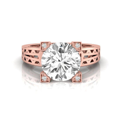 Round cut lab grown diamond engagement ring featuring a four-prong setting with round accent diamonds and a geometric rose gold style openwork band.