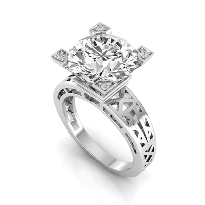 Round cut lab grown diamond engagement ring featuring a four-prong setting with round accent diamonds and a geometric white gold style openwork band.