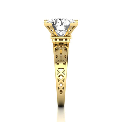 Round cut lab grown diamond engagement ring featuring a four-prong setting with round accent diamonds and a geometric yellow gold style openwork band.