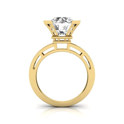 Round cut lab grown diamond engagement ring featuring a four-prong setting with round accent diamonds and a geometric yellow gold style openwork band.