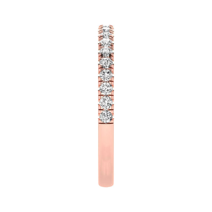 Round prong set lab grown diamond half eternity band ring featuring round diamonds in an elegant stackable wedding band design in rose gold