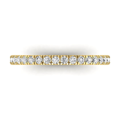 Round prong set lab grown diamond half eternity band ring featuring round diamonds in an elegant stackable wedding band design in yellow gold