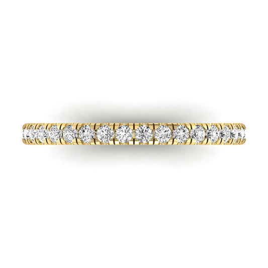 Round prong set lab grown diamond half eternity band ring featuring round diamonds in an elegant stackable wedding band design in yellow gold